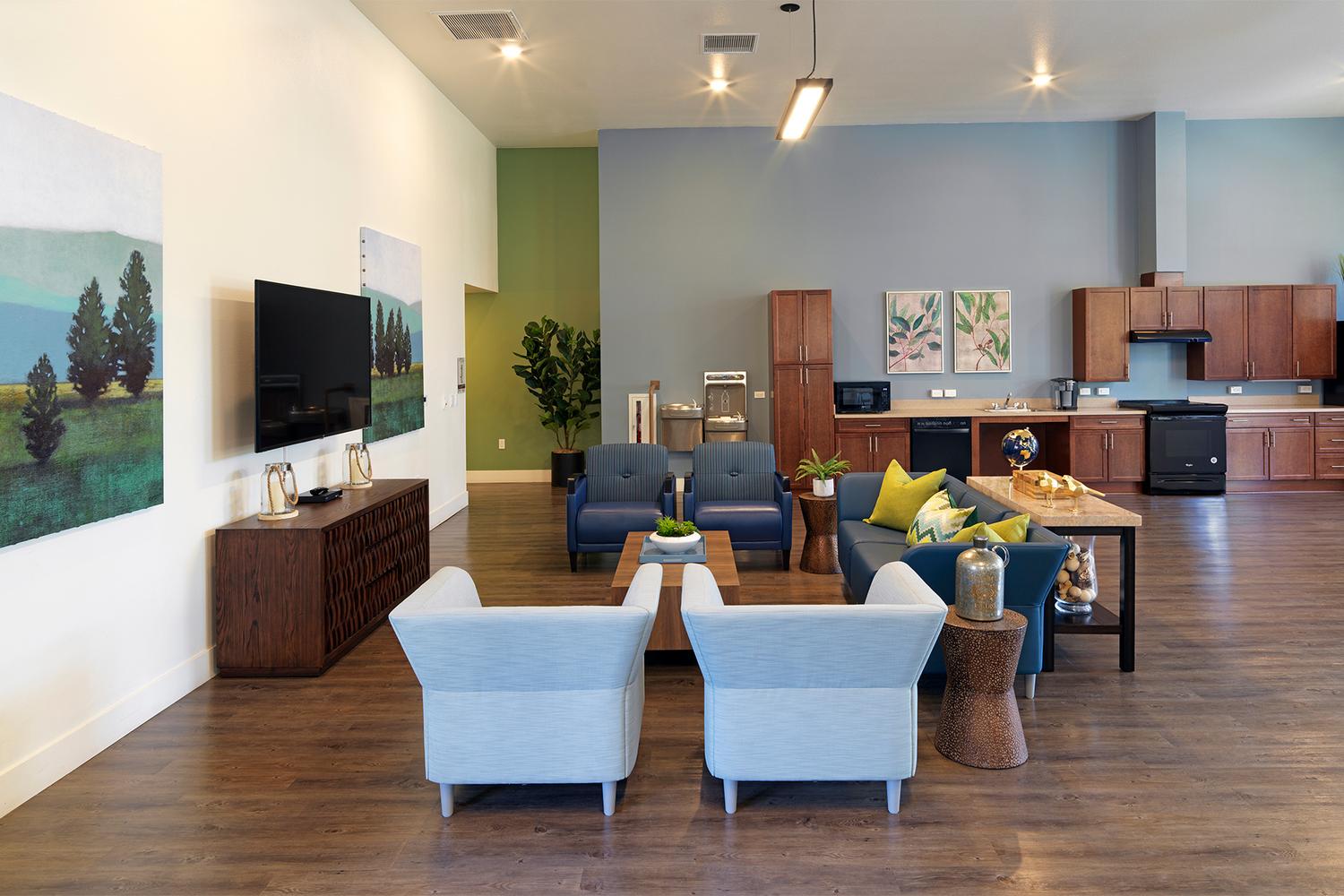 a living room filled with furniture and a flat screen tv.
